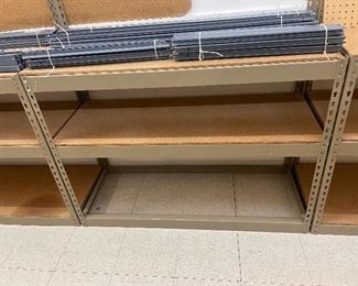 Heavy duty metal & wood deck shelving. There are 4 36x18" deep three tier shelves and 5 36x 24" shelves.