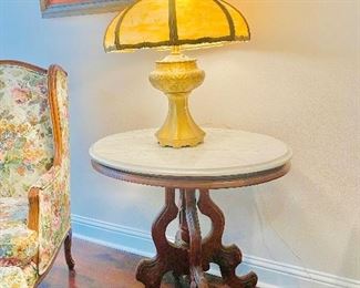 Marble top table, slag glass lamp