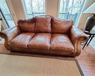 LEATHER 3 SEAT COUCH W/NAIL HEAD ACCENTS - THIS ITEM HAS SOME WEAR