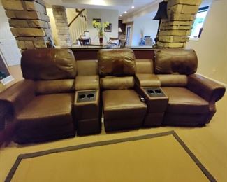 3 - SEAT ELECTRIC RECLINING LEATHER THEATRE SEATING - HAS SOME MINOR WEAR IN THE HEAD REST ON 2 OF THE CHAIRS