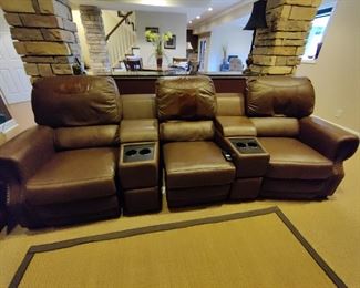 3 - SEAT ELECTRIC RECLINING LEATHER THEATRE SEATING - HAS SOME MINOR WEAR IN THE HEAD REST ON 2 OF THE CHAIRS