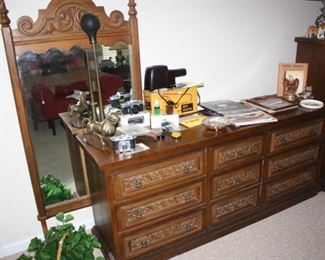 Unsold bedroom suite.  Bed, dresser, mirror, side table.   You pay $150 after we apply the 50% off.  You must move it yourself.  Many of the items on the table are sold.