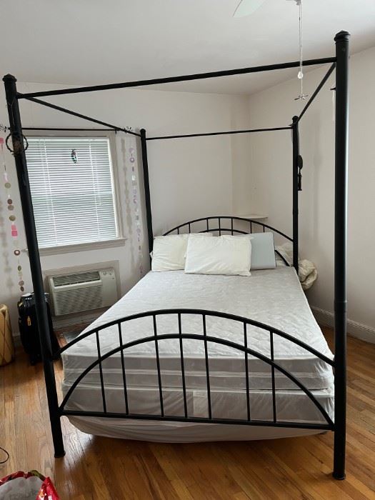 Full size four post canopy bed in black, selling with or without mattress.