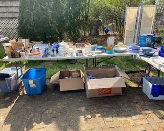 Variety of kitchen and serving items, glasses, plates, pots, pans, canisters