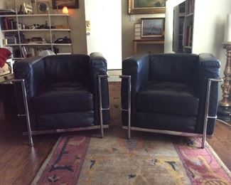 $1600 - Two LC2 Courbusier arm chairs by Alivar in black leather.  Made in Italy.