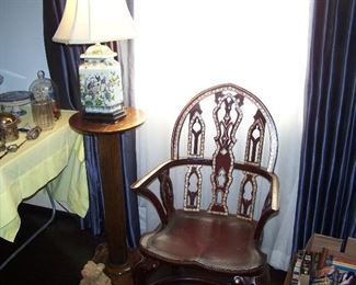 LEATHER COVERED CHAIR WITH GILT ACCENTS