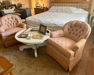 King bed,  2 matching swivel rockers, round white table.