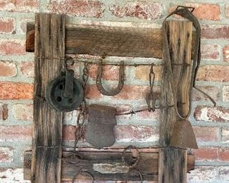 Interesting rustic art. Old pully and cow bell sold separately.
