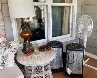 Vintage wicker table, lamp, ashtrays, heaters and floor fan.