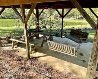 Nice vintage porch swings and picnic table...