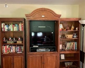Entertainment cabinet, Samsung TV and DVD player, duck decoys, turned wooden pieces, books, baskets and more