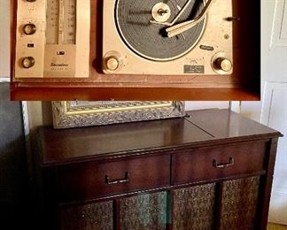 Vintage Philco Stereophonic stereo with turntable and radio, gold framed mirror. 