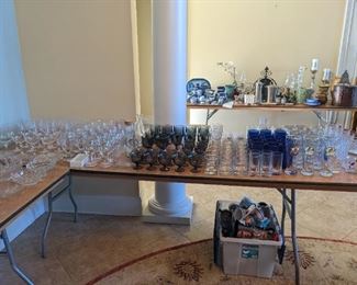 Many sets of stemware, wineglasses, cups