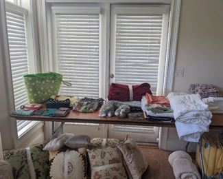 Purses, sheets, decorative pillows