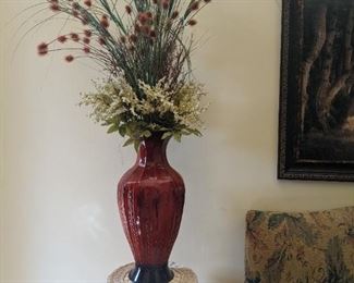 Wicker plant stand, large vase and floral arrangement