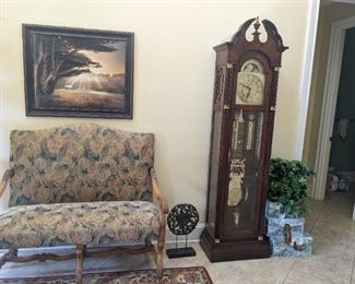 Foyer bench, grandfather clock, framed print