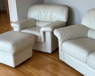 Lovely Leather Ivory Loveseat in very good condition. The seating area appears to be leather, while the base is a handmade material. 

Love Seat Measures 61" x 31", the ottoman is 24" x 18" and the chair measures 38" arm to arm.