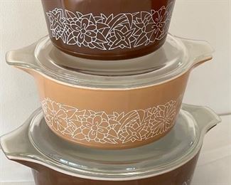 Pyrex Three Piece Woodland Nesting Casserole Dish Set in good condition. No seen chips or cracks. 