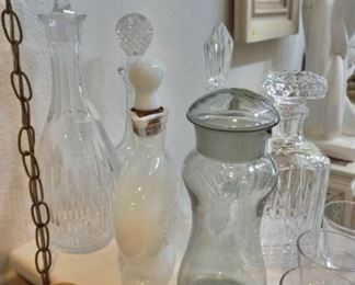 so many gorgeous vintage decanters including Holmegaard, and crystal