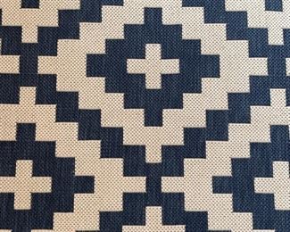 Graphic blue and white indoor/outdoor rug - 2 available. Each measures 7' 7" x 5' 3." Photo 2 of 2.