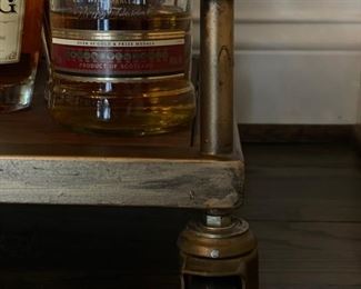 Metal bar cart on casters with brass finish. Measures 24" W x 16" D x 33" H. Photo 3 of 3.