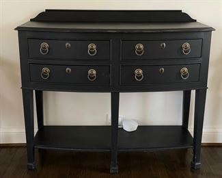 Ebony four-drawer console with decorative pulls and shelf. Measures 46" W x 18" D x 36" H. Photo 1 of 4.