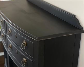 Ebony four-drawer console with decorative pulls and shelf. Measures 46" W x 18" D x 36" H. Photo 2 of 4.
