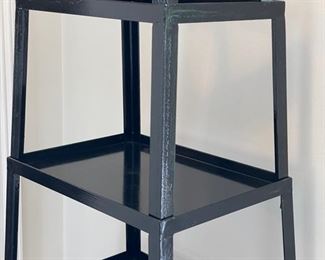 Black lacquer metal etagere - 2 available. At widest point, each measures 20" W x 16" D x 73" H. Photo 3 of 3.