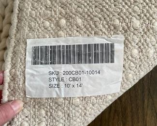 Chunky hand-woven wool rug. Measures 10' x 14'. Photo 3 of 3.