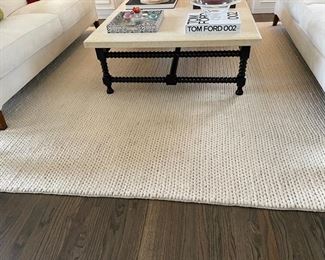 Chunky hand-woven wool rug. Measures 10' x 14'. Photo 1 of 3.