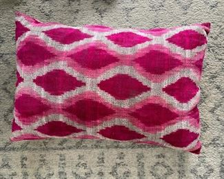 Pink IKAT lumbar pillow.