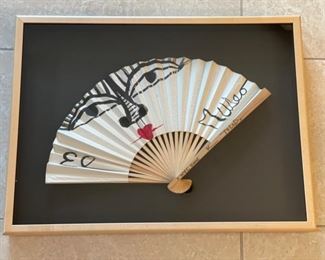 Commemorative fan signed by artist Ruben Toledo.