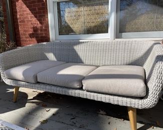 Mid-century modern-style woven all-weather wicker sofa. Photo 1 of 3.