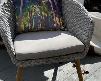Mid-century modern-style woven all-weather wicker chair. Photo 1 of 2.