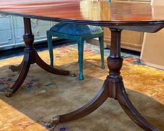 Vintage Georgian double pedestal mahogany dining table with brass claw feet. Measures 80" W x 31" D x 29" H with 28" clearance. Photo 1 of 4.