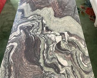 South Loop Loft marble and chrome cocktail table. Measures 55" W x 32" D x 13" H. Photo 1 of 3.