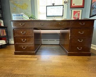 Vintage English reproduction leather-top flame mahogany desk. Measures 72" W x 36" D x 32" H. Photo 1 of 3.