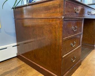 Vintage English reproduction leather-top flame mahogany desk. Measures 72" W x 36" D x 32" H. Photo 2 of 3.