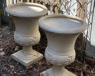 Pair of faux concrete urns.