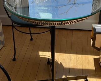 Vintage Arthur Umanoff glass-top bistro table with faux all-weather bamboo trim. Photo 1 of 2.
