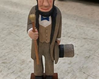 Hand-carved folk art Lincoln statue signed by artist. Photo 1 of 2.