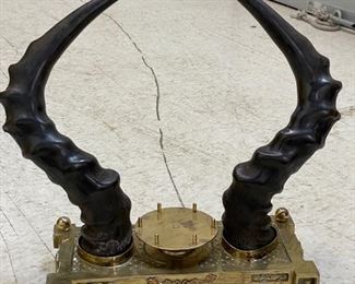 Brass inkwell with horns.