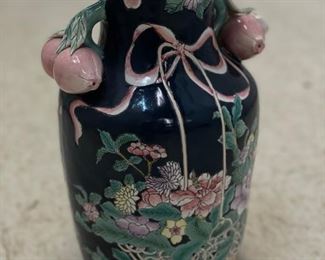 Navy urn with pomegranate handles and flowers. Photo 1 of 3.