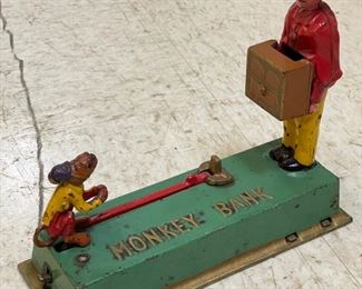 Antique cast iron monkey bank. Photo 1 of 3.