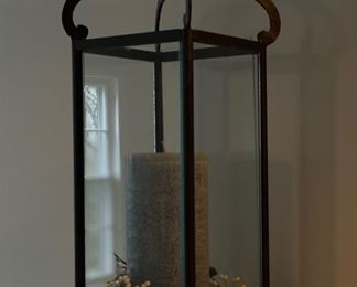 Pair of glass and metal lantern-style candle holders.