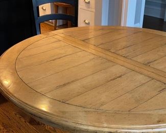 Oak pedestal dining table. Measures 48" D x 30" H with 26.5" clearance. Photo 1 of 2.