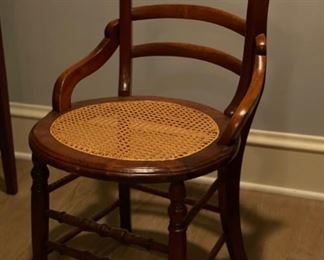 Antique cane-seat chair. Photo 1 of 3.