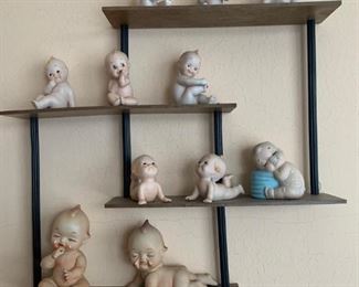 Kewpee dolls and shelf unit