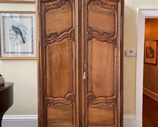 Antique French provincial wall cabinet with metal hardware. Measures 52" W x 26" D x 100"H. Photo 1 of 6.