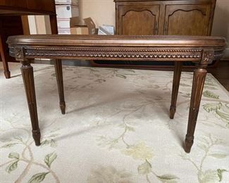 Gustavian-style cane-top cocktail table. Measures 36" W x 15" D x 18.5" H. Photo 2 of 3.